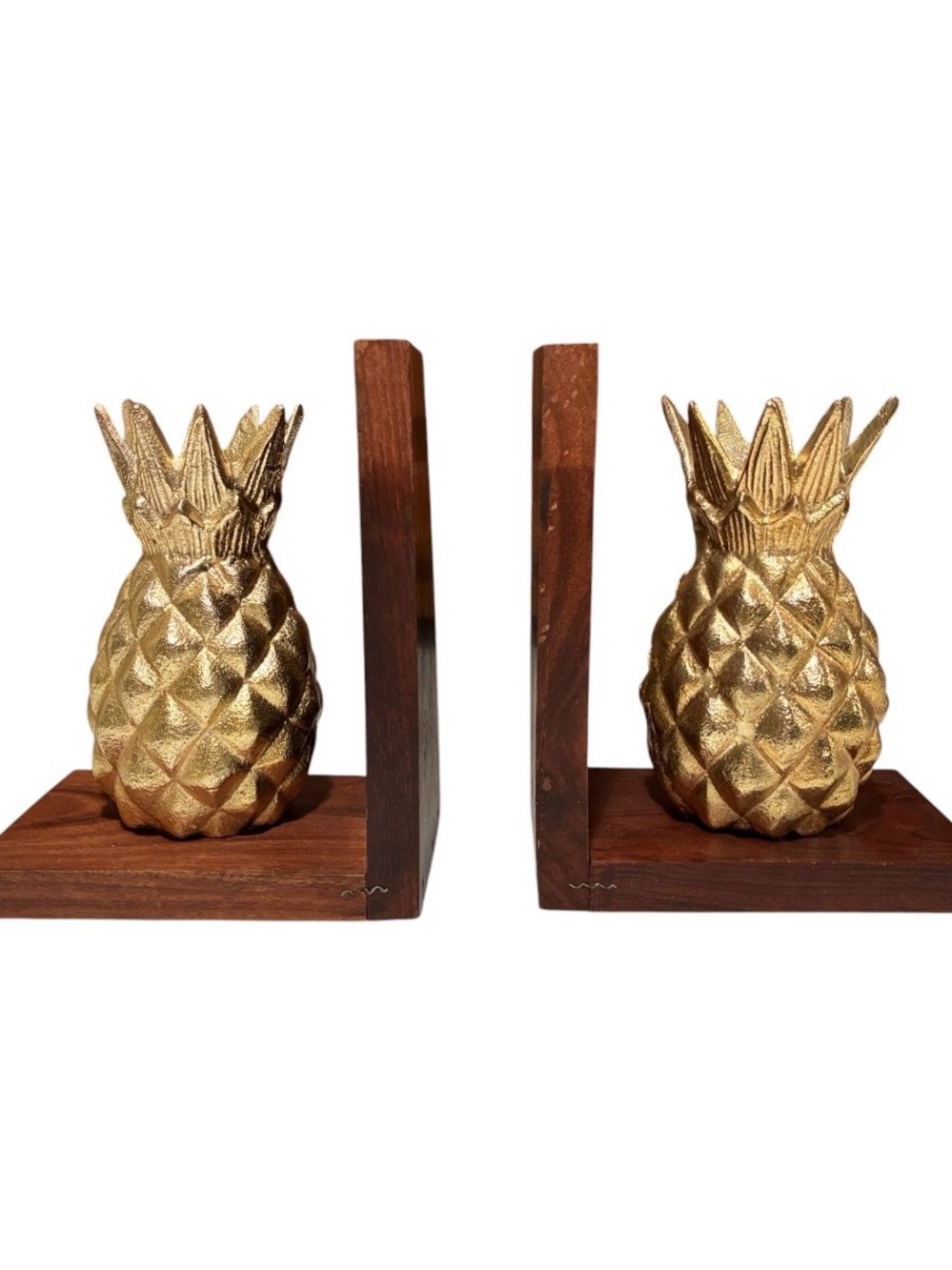 Modern gold pineapple bookends with wooden bases from Marshals.